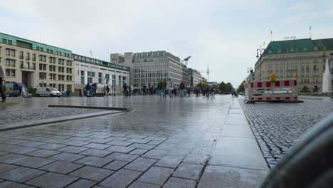 Crowd-Of-People-On-A-Rainy-Day-At-Pariser-Platz,-Square-In-Historic-Centre-Of-Berlin-In-Germany