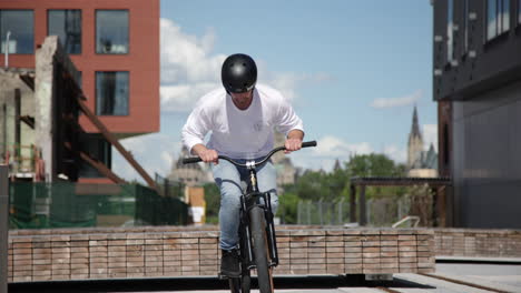 Extreme-sports-BMX-mountain-biking-bar-spin-on-street-spot