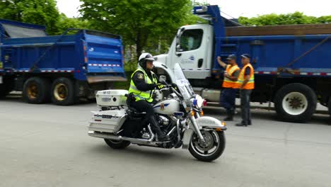 Motorized-policeman-come-at-high-speed-to-riot-in-Quebec,-Canada