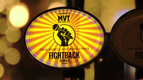 Fightback-lager-beer-logo-glowing-yellow-inside-bar-in-central-London