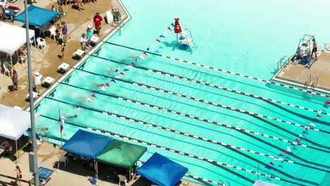 Joyful-day-at-a-swimming-pool,-where-backstroke-swimming-meet-had-just-begun