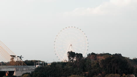 A-close-up-shot-of-the-'Yup-Star'-Ferris-wheel-in-Foz-do-Iguaçu,-Brazil,-showcasing-its-details,-colors,-and-the-thrill-it-brings-to-visitors