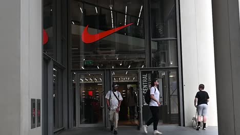 Man-approching-from-the-Nike-Store,-London,-United-Kingdom