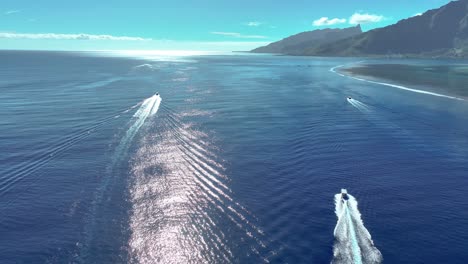 Aerial-Following-Sailing-Boats-Near-Coast-Of-Mo'orea-Island,-South-Pacific-Ocean,-French-Polynesia