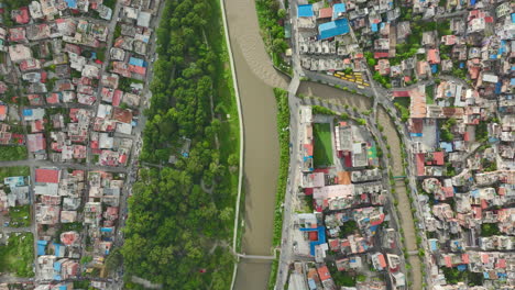 Drone-shot,-Green-City-Kathmandu-Nepal,-Electric-Vehicles,-River,-Urban-modern-Houses,-architectures,-Road