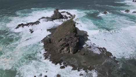 Rough-terrain-in-the-Indonesian-ocean,-rock-formation-Watu-Lumbung-beach,-aerial