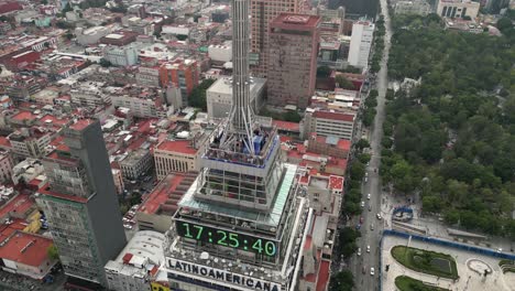 Drone-view-up-close-of-rooftop-and-digital-clock-Latinoamericana-Tower
