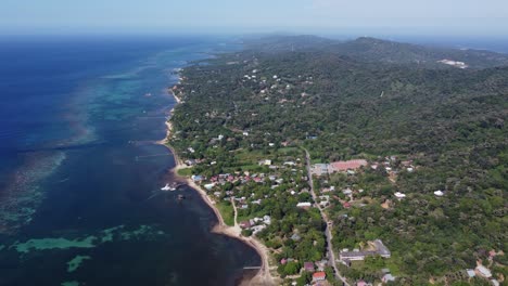 High-aerial-flyover:-Roatan-Island-coral-reefs-in-Caribbean-Honduras