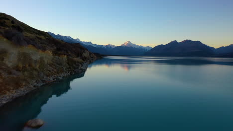 Scenic-aerial-view-of-majestic-Mount-Cook-at-sunset-from-Lake-Pukaki,-New-Zealand