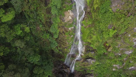 Aerial-looks-down-onto-Cascada-el-Bejuco-waterfall-on-Honduras-cliff