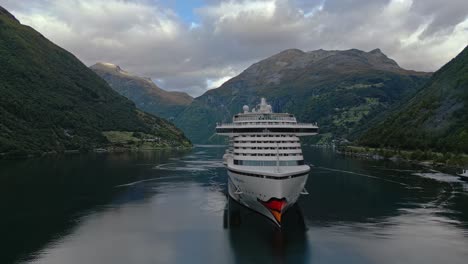 A-cruise-ship-from-the-AIDA-line-moored-of-the-village-of-Gieranger-at-the-head-of-the-Geirangerfjord,-Norway