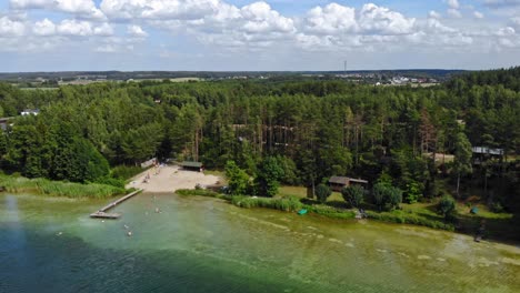 Aerial-view-of-a-swimming-area-on-Lake-Jezioro-Gwiazdy-in-Borowy-Młyn,-Poland