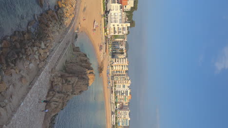 vertical-video-of-the-main-square-of-Blanes-on-the-Costa-Brava,-prores-copy-Space