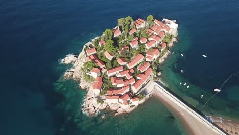 aerial-top-down-of-Sveti-Stefan-island-town-in-Budva-Municipality,-on-the-Adriatic-coast-of-Montenegro