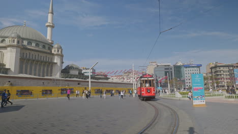 Istanbul-city-iconic-electric-red-public-trams-pass-on-Istiklal-street