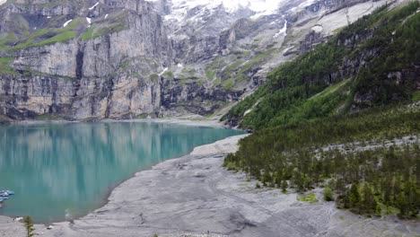 Turquoise-azure-alpine-lake-Oeschinensee-in-Swiss-alps-Mountains,-Switzerland