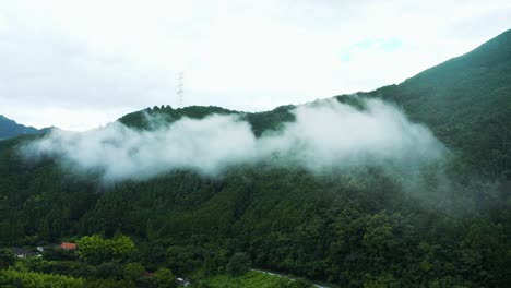 Mountain-Misty-Clouds-over-Rural-Japanese-Landscape-in-Saijo,-Shikoku