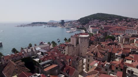 Split,-Croatia:-Aerial-of-Venetian-Tower,-coast,-and-historic-town-backdrop