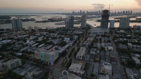 aerial-of-south-beach-during-sunset-with-skyline-cityscape-and-ocean-road-famous-avenue