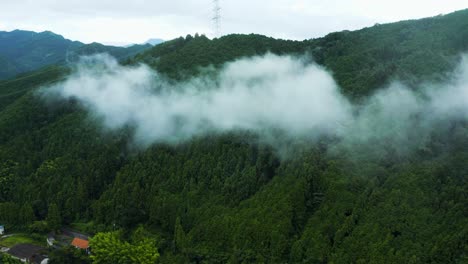4k-Aerial-Tilt-over-Beautiful-Misty-Mountain-Landscape-of-Saijo,-Japan