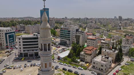Palestine-Tower-Cinema,-Residential-Neighborhood-And-Muslim-Mosque-Minaret-in-Ramallah-City-In-Palestine