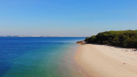 Drone-shot-from-the-beach-in-Troia,-Portugal