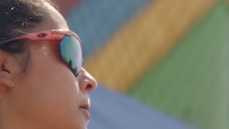 Beach-tennis-player-wearing-cool-sunglasses-to-stave-of-the-bright-sunlight