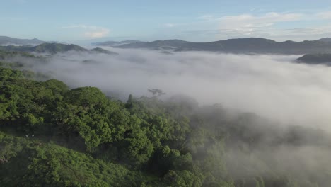 Scenic-Cloud-Fog-Covering-Green-Costa-Rica-Jungle,-4K-Aerial-Drone-Flyover