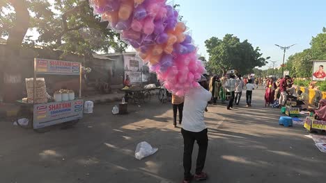 A-shopkeeper-is-selling-colorful-and-tasty-cotton-candy-on-the-street-road