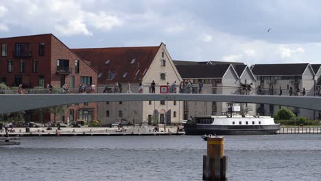 People-walking-and-bicycling-across-the-Inner-Harbor-Bridge-in-Copenhagen-city-centre---Closeup-of-middle-section-of-bridge-in-Denmark