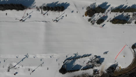Top-view-from-drone-ski-lift-transportation-skiers-and-snowboarders-at-bear-creek