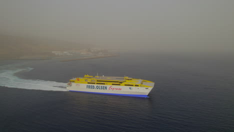 aerial-view-with-lateral-tracking-of-the-ferry-on-a-day-with-a-lot-of-haze-in-the-air