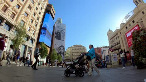 Madrid,-Spain:-Join-us-for-a-virtual-walk-along-Madrid's-crowded-avenues,-captured-in-an-amazing-shot-that-transports-you-to-the-heart-of-the-city