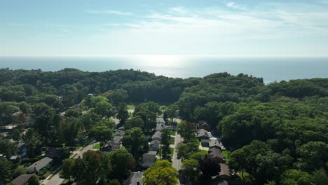 Still-look-at-glimmering-waters-of-Lake-Michigan-above-a-small-town