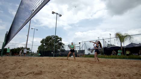 High-and-over-the-net-is-the-aim-of-the-beach-tennis-women-players