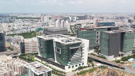 Aerial-Cinematic-Footage-Of-Car-Moving-Through-Hitech-City-Hyderabad