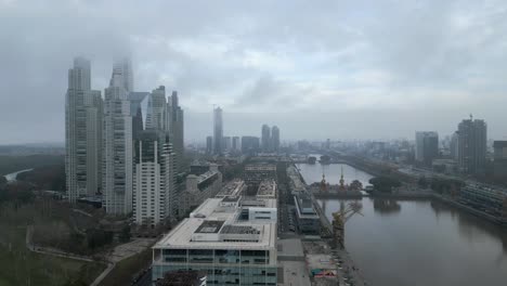 Panoramic-aerial-view-of-Argentina-highrise-buildings-and-hotels-under-foggy-sky-due-to-climate-change,-Buenos-Aires