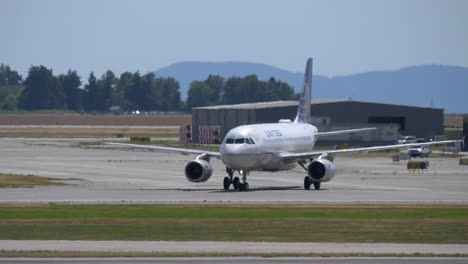 A-united-Airbus-A320-Airplane-Taxies-Onto-the-Taxiway-at-the-Airport