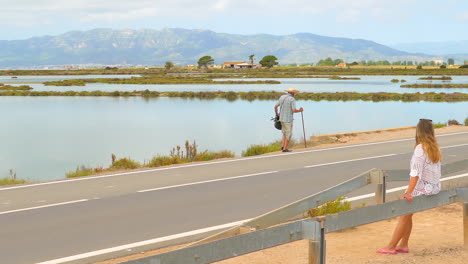 Woman-sitting-overlooking-the-view-of-the-Ebro-delta-in-Spain