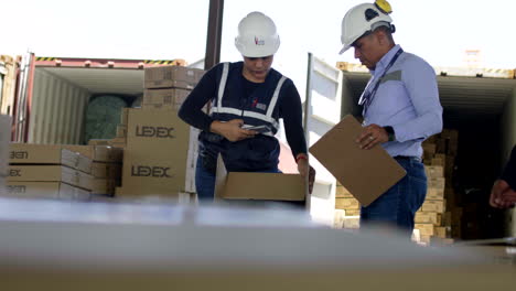 general-shot-of-people-checking-boxes-in-customs