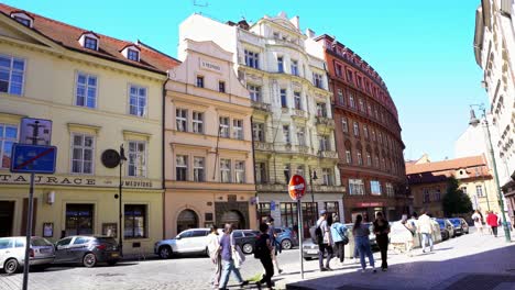 Representative-architecture-of-Prague,-Czech-Republic-with-tourists-and-citizens-walking-on-a-sunny-and-clear-day