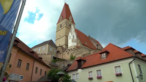 Churhc-of-Weißkirchen-in-Steiermark-with-Family-Sitting-near-the-Entrance-to-Church