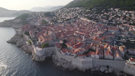 Drone-view-of-historic-Dubrovnik-Old-Town-and-its-fortified-stone-walls,-Croatia
