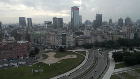 Cinematic-drone-shot-of-the-official-workplace-of-the-president-of-the-Argentine-The-Pink-House-and-neighborhood,-Highrise-buildings-of-Buenos-Aires-under-the-cloudy-sky,-Argentina