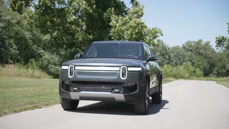 Electric-truck-driving-down-the-road