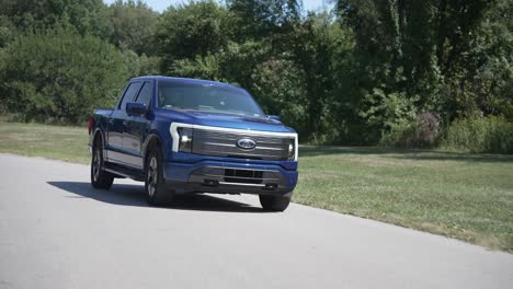 Ford-F150-lightning-truck-driving-down-the-road