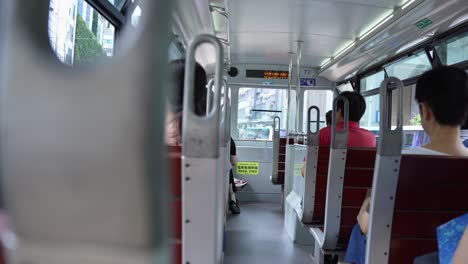 Trams-in-the-city-of-Victoria-Hong-Kong-ride-with-full-of-passengers
