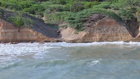 Rocky-cliffs-along-Playa-Matanzas-beach,-Bani-in-Dominican-Republic