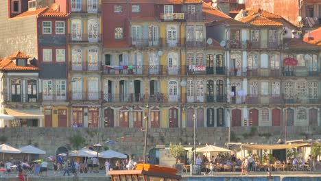 Scene-Of-People-At-The-Ribeira-Riverfront---World-Heritage-Site-UNESCO-In-Porto,-Portugal