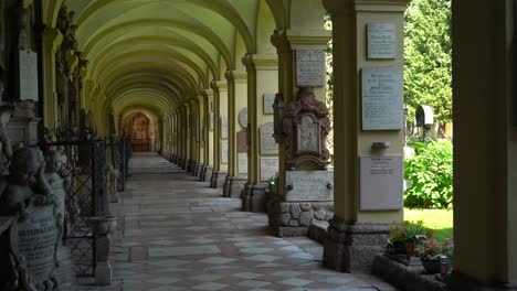 Person-Walking-in-the-Distance-of-Cemetary-of-Rectorate-Church-of-St